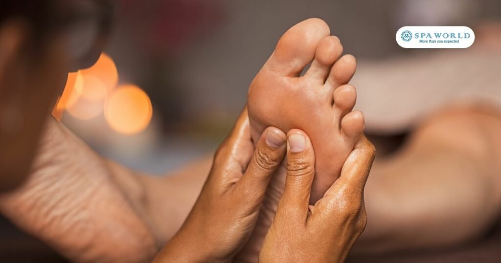 therapist performing foot reflexology