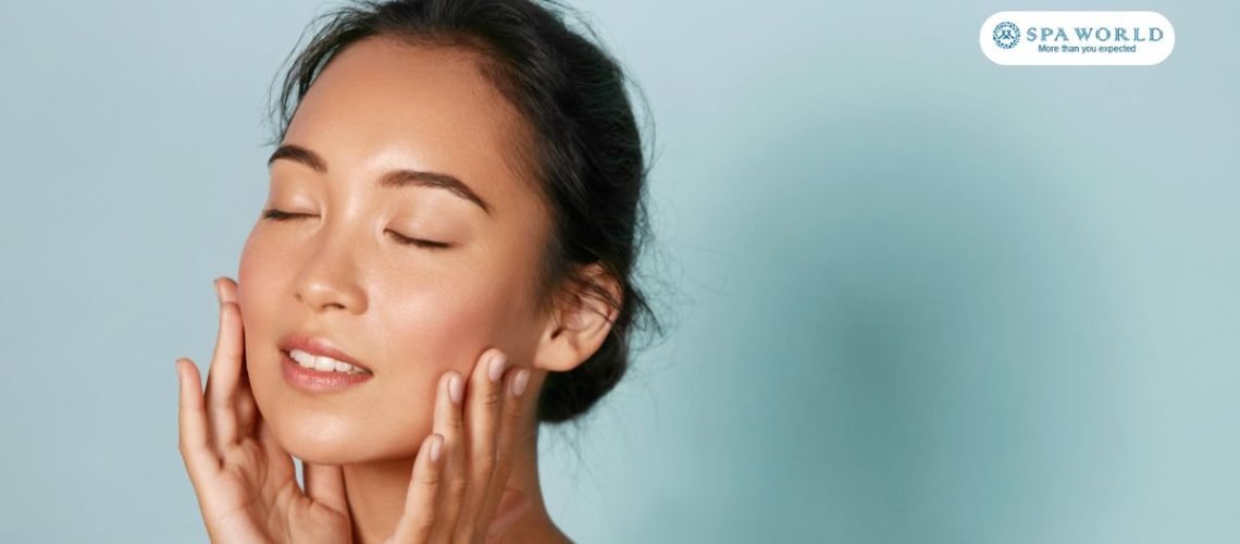 girl touching her face to experience its softness after a summer exfoliation